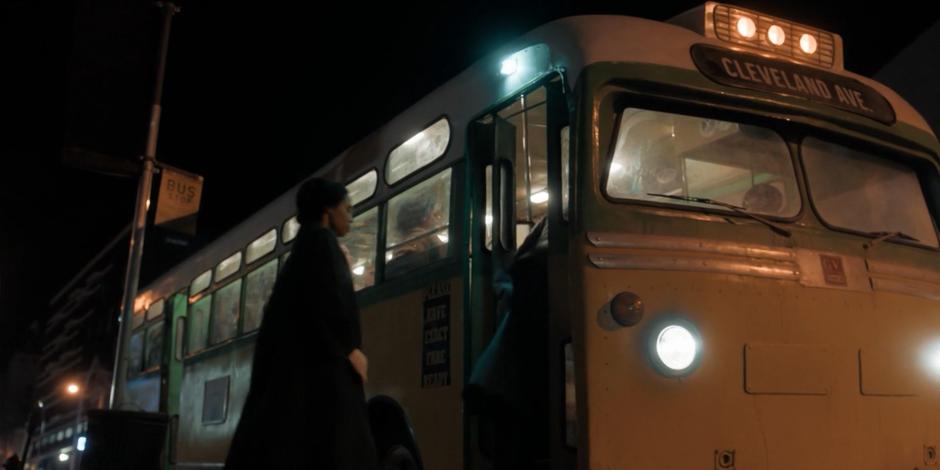 Rosa Parks walks up to the front door of the bus.