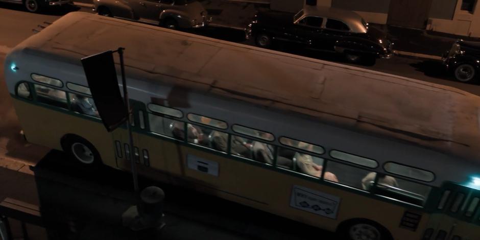 The bus pulls away from the stop after picking up Rosa Parks and the others.