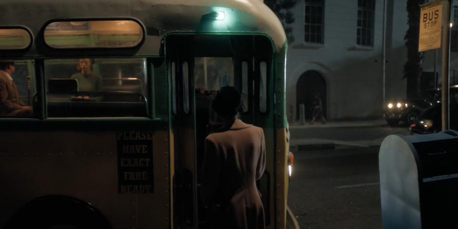 Rosa Parks enters the bus through the front door.