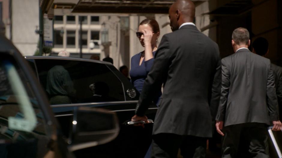 Diana Lindsay takes off her sunglasses as she gets into her waiting limo.