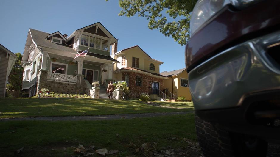 Ben Thompson walks up the stairs to the front of his home.