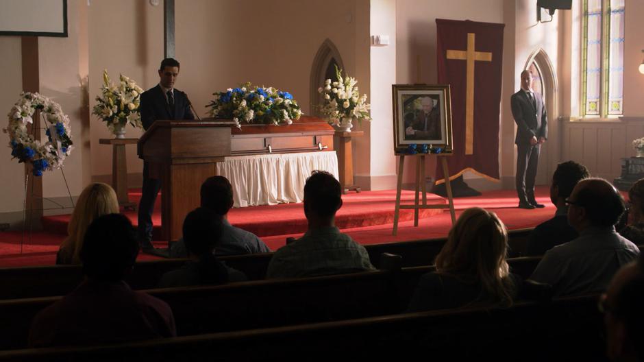 Ben Lockwood stands at the front of the church giving his eulogy.