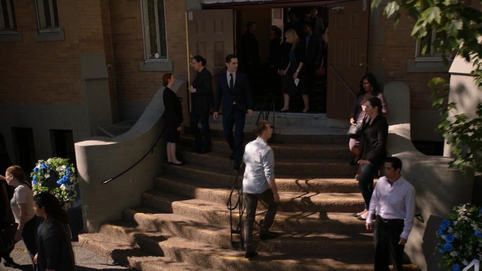 Ben Lockwood looks around as he exits the church after the funeral.