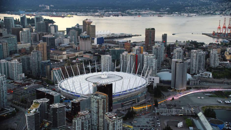 Barry and Nora zip across the city into the stadium.