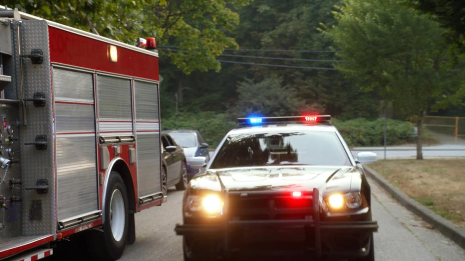 A police car pulls up to the field after the explosion.