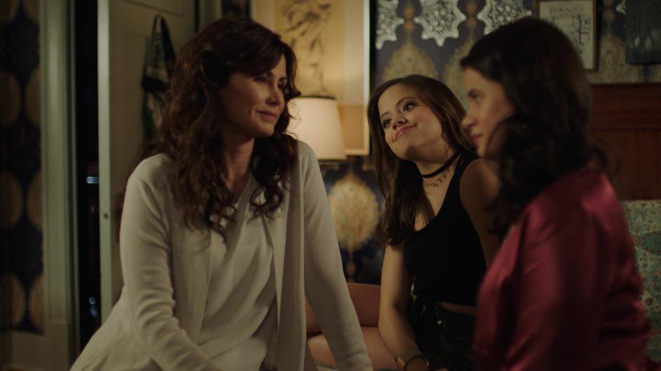 Marisol sits on the bed with Maggie and Mel and tells them how important their are together.