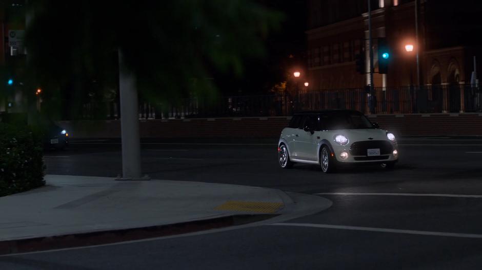 Karolina drives her car around the corner following Alex's trail.