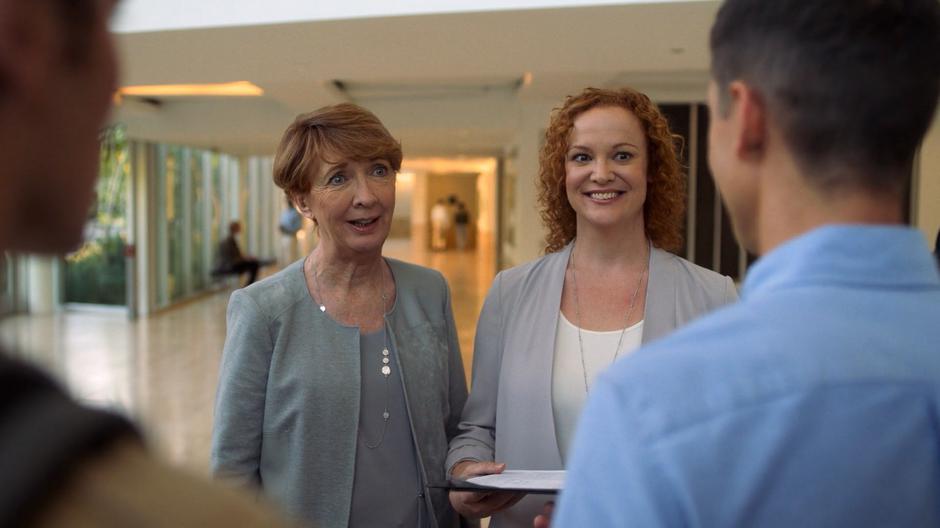 Aura and Frances smiles when Vaughn shows them the faked intake paperwork for Chase and Molly.