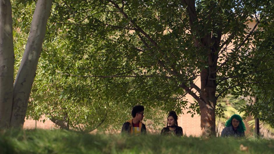 Alex, Nico, and Gert talk while waiting on the other side of the lawn.