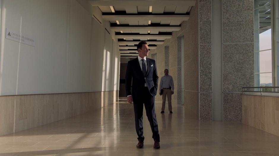 Jonah talks to the Wilders while one of the church's employees waits back down the hallway.