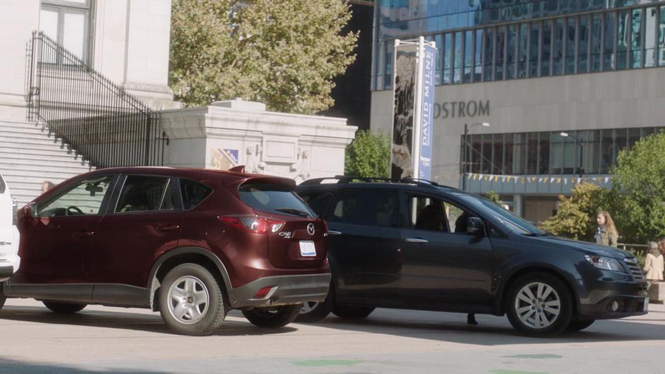 Maggie and Mel get into their car in plain view of Trip.