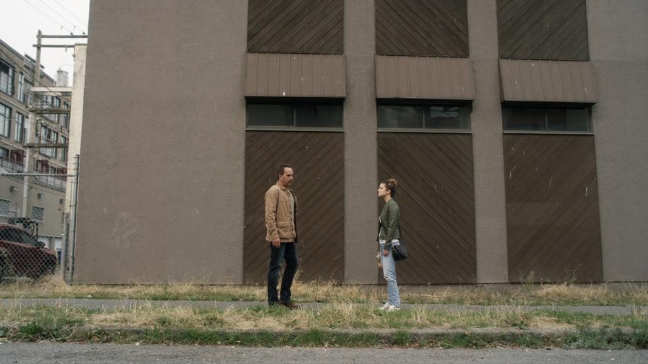 Ben stops to talk to Izzy on her side of the street.