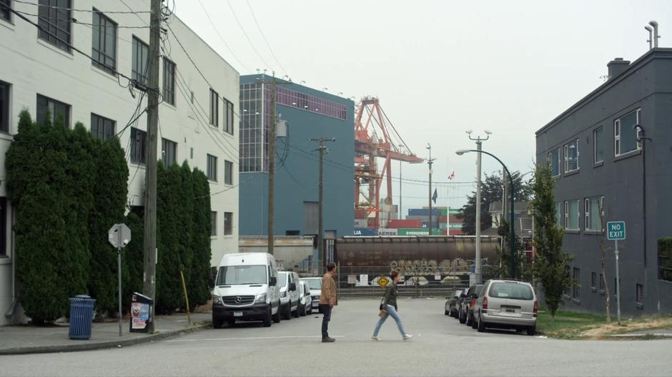 Ben stops in the middle of the intersection as Izzy continues walking.