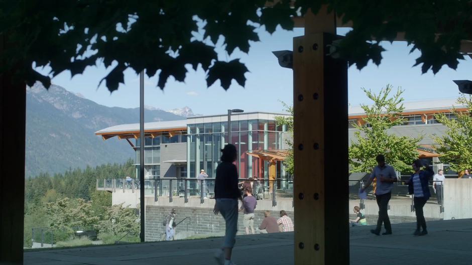 Students walk around outside around the campus.