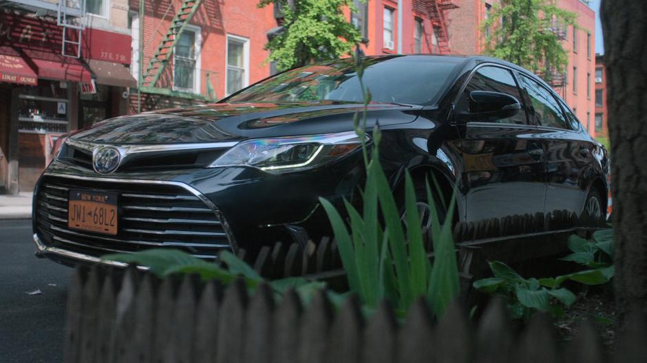 Trish pulls her car away from the curb.