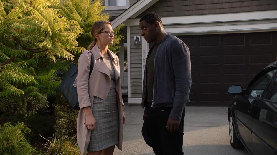 Kara and J'onn discuss their strategy before going inside.