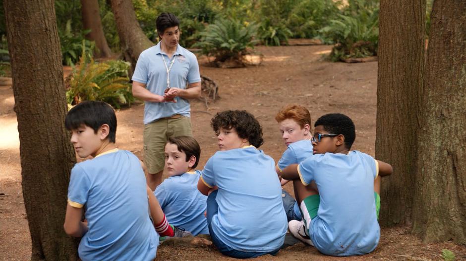 The five campers look over their shoulders at Constantine as Ray tries to get their attention.