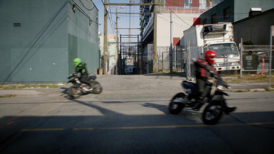 The two motorcylists split up and head in different directions.