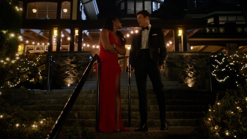 Barry walks down the steps to talk to Iris after she walked out of the party.