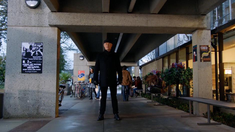 Damien Darhk stands in the walkway and asks for the Legends' help.