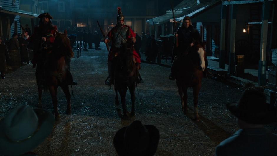 Blackbear, Caesar, and Freydis ride up to the Legends on horseback.