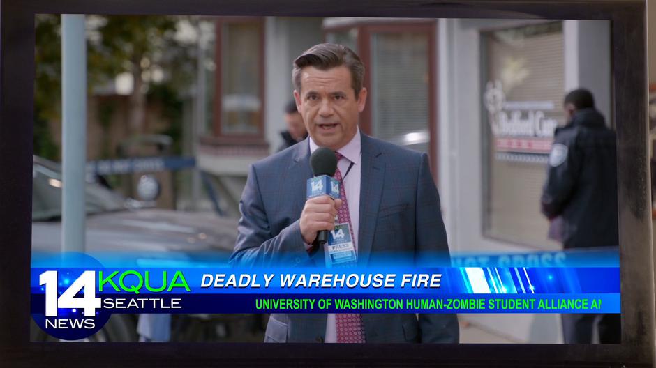 Johnny Frost harrasses a coworker during a news report on a warehouse fire.