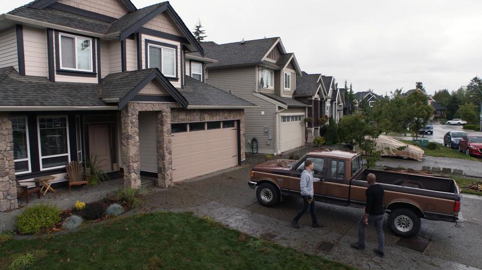 James walks up to Tom who is reaching for the door of his truck.