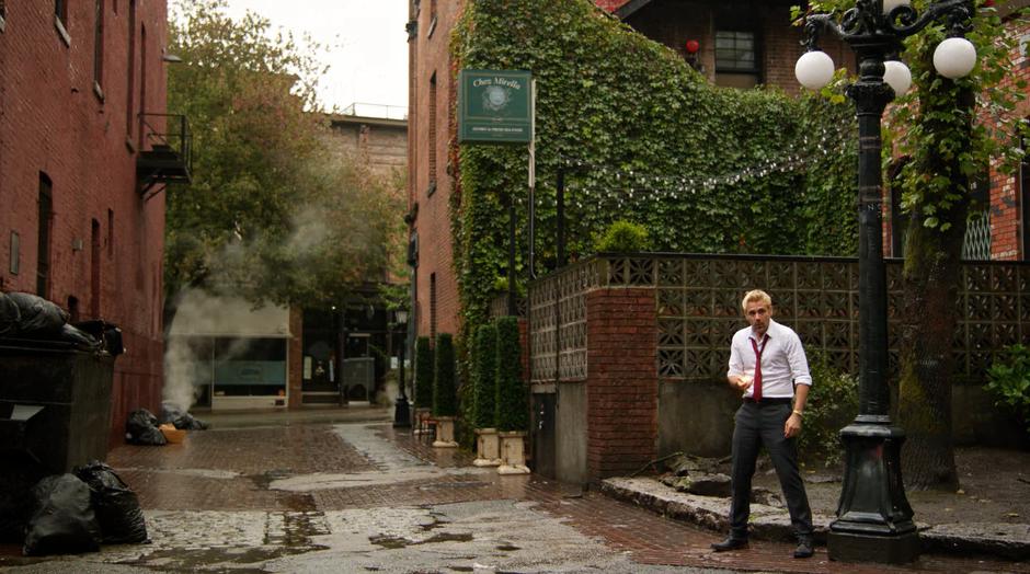 Constantine lands in the alley next to his old apartment in New Orleans.