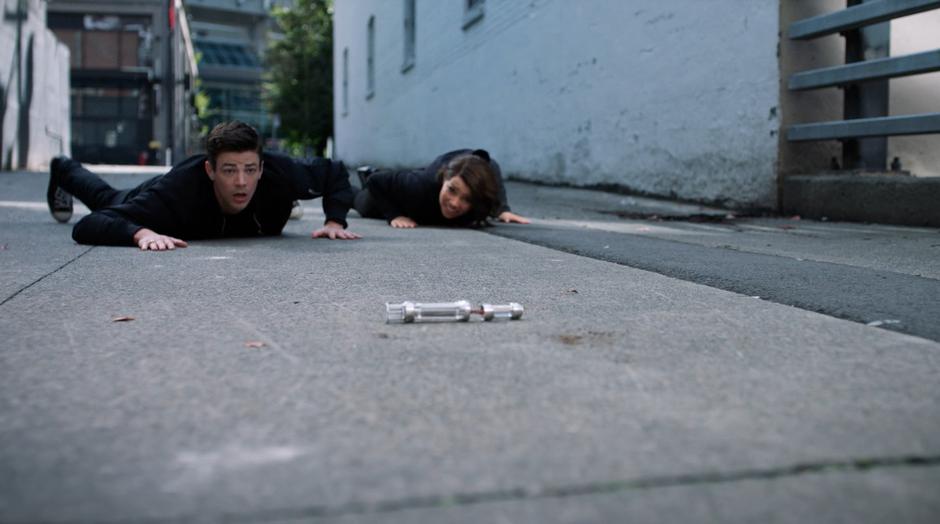 Barry and Nora look up after being thrown out of the Speed Force and see the device broken on the ground.