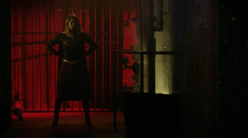 Kara stands at the end of the hallway facing Dr. Deegan.