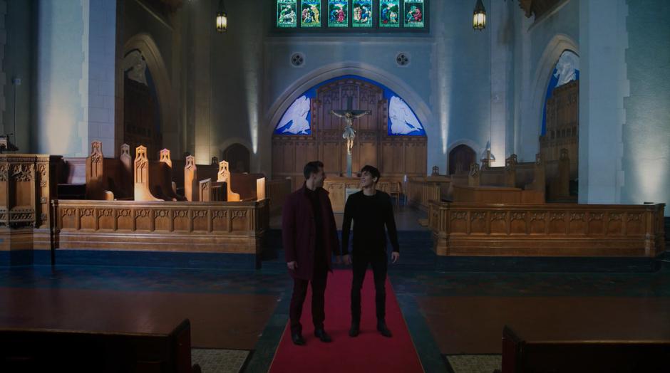 Hunter and Parker share a look after materializing in the middle of the cathedral.