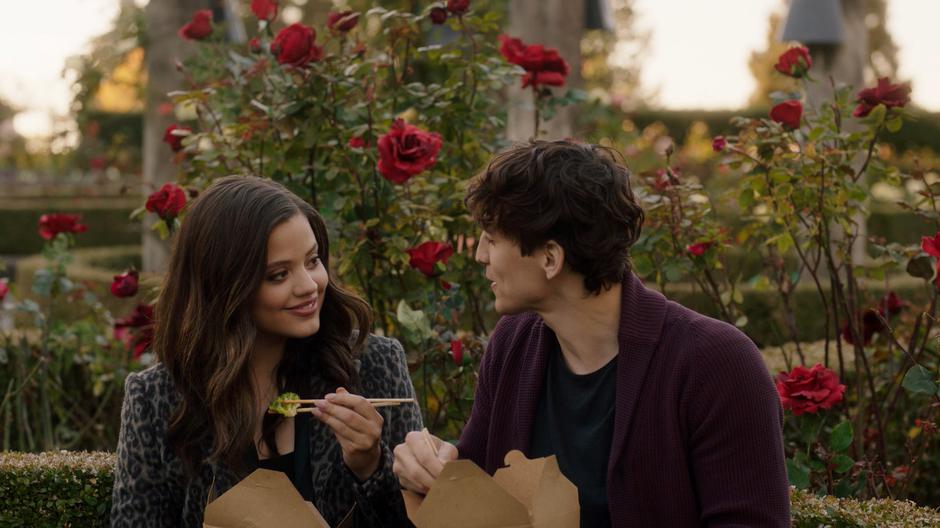 Maggie smiles as Parker as they eat their vegan lunch.