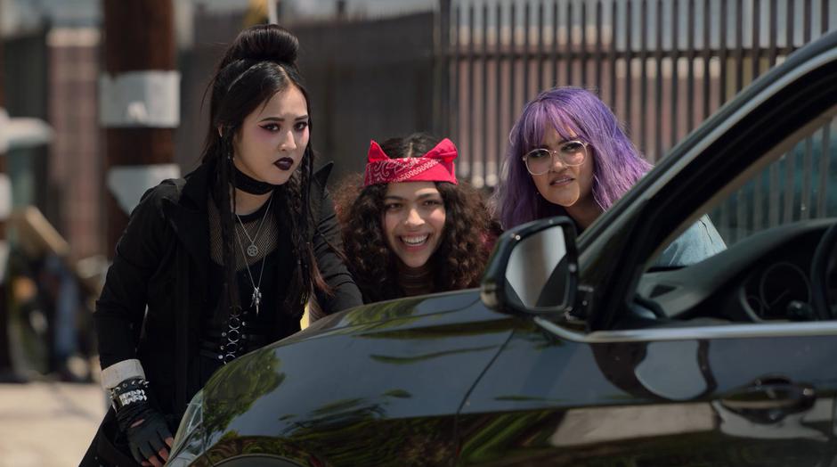 Nico and Gert watch the theft with concern while Molly has a giant smile on her face.