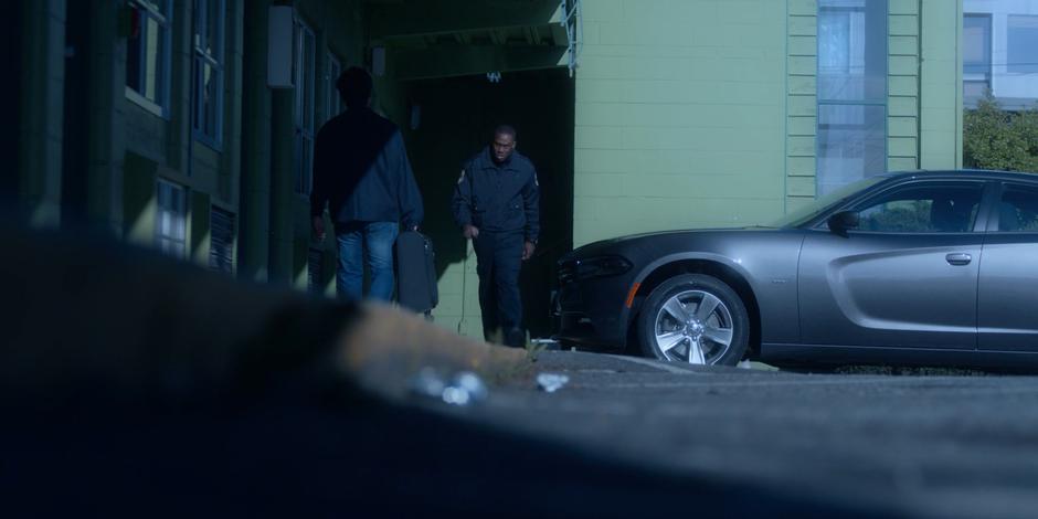 Jeff walks alongside the parking lot to his car.