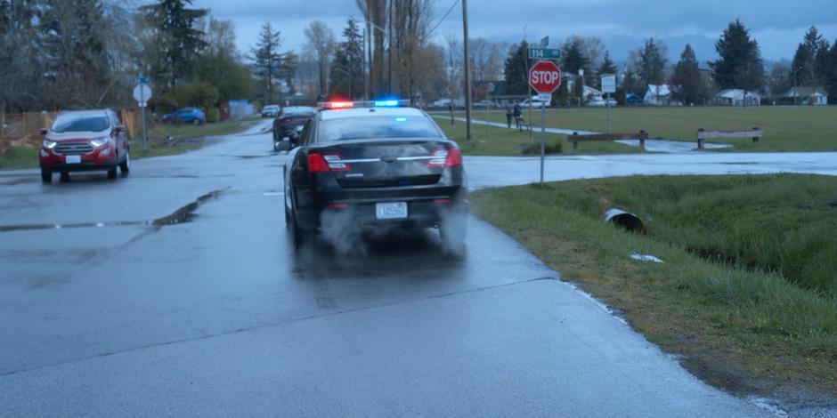 A police car turns on its lights and starts to follow Jeff.