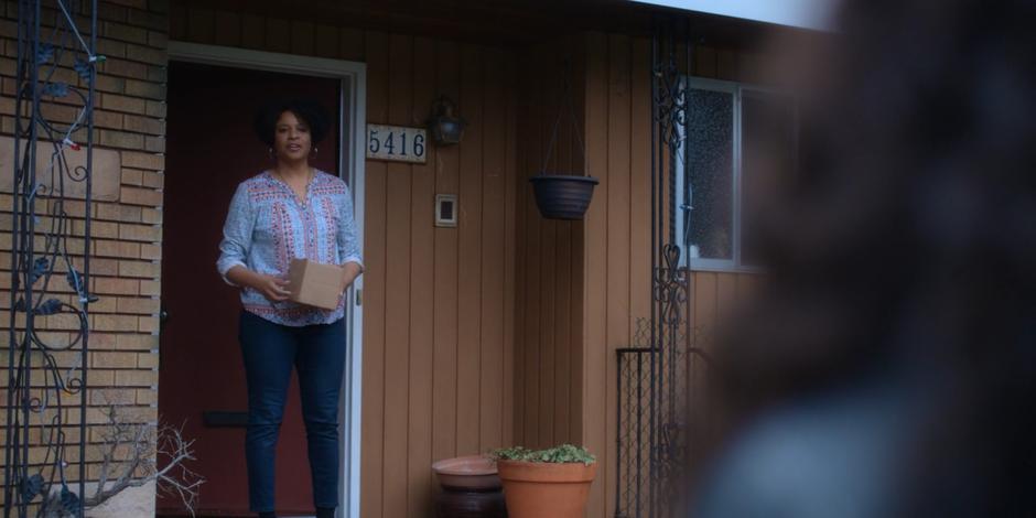 Jeffrey's new foster mother watches as Carly leaves.