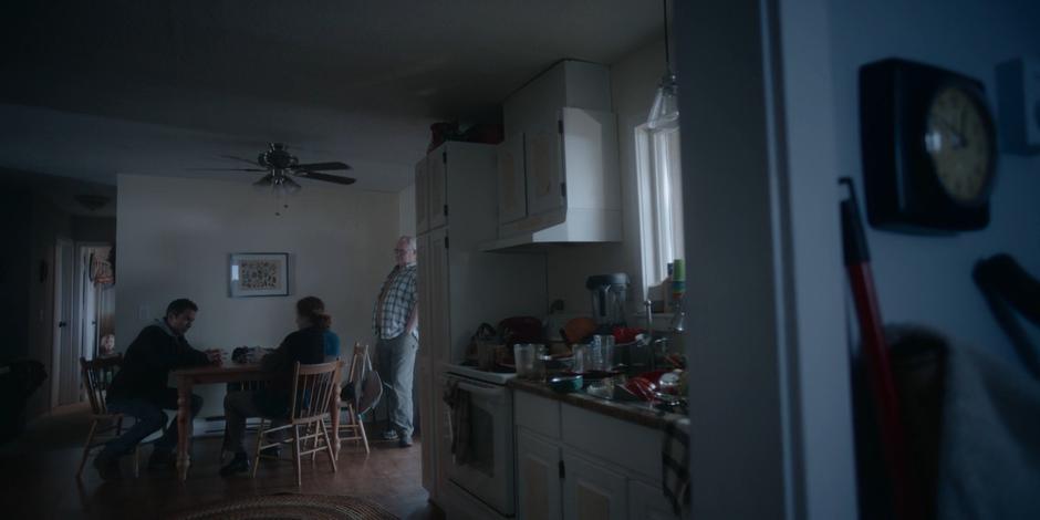 Grant talks to the MacVicars in their kitchen about what he did yesterday.