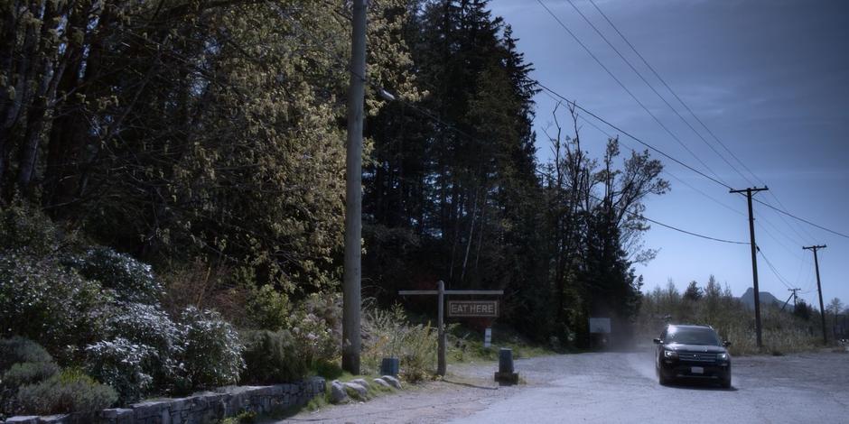 Grant drives up to the diner with Trevor and Aleksander.