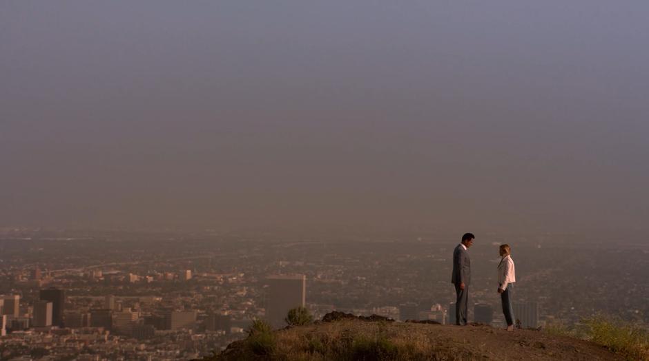 Jonah and Karolina stand on the hilltop after the earthquake.