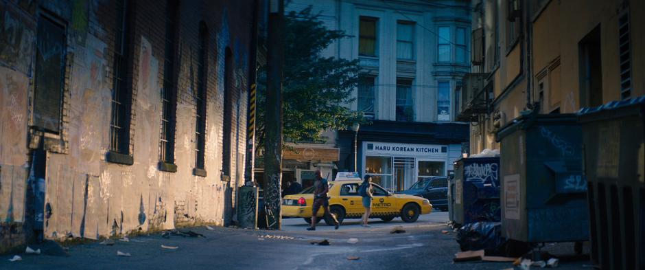 Wade exits the taxi and walks to his apartment.