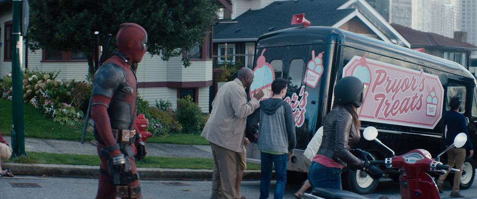 Wade notices a woman leaving her scooter to look at the carnage.