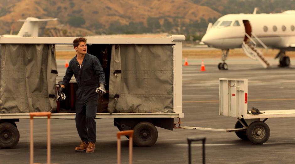 Alex hops out of the luggage cart with his Fistagons.