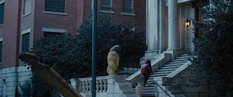 Russell and Juggernaut climb the stairs to the facility's front door.