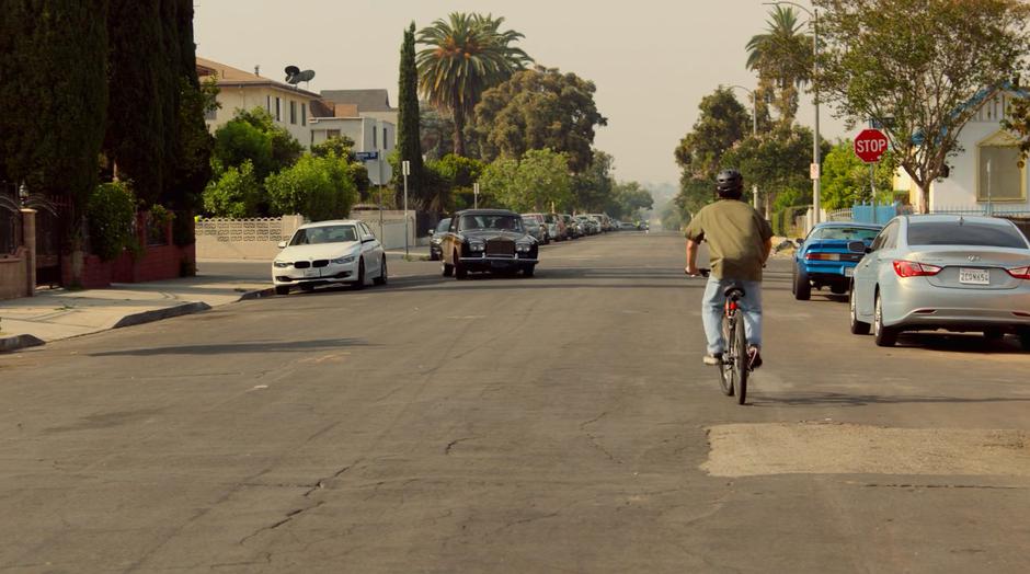 The Runaways turn the corner in a quiet neighborhood after losing sight of Topher's stolen car.