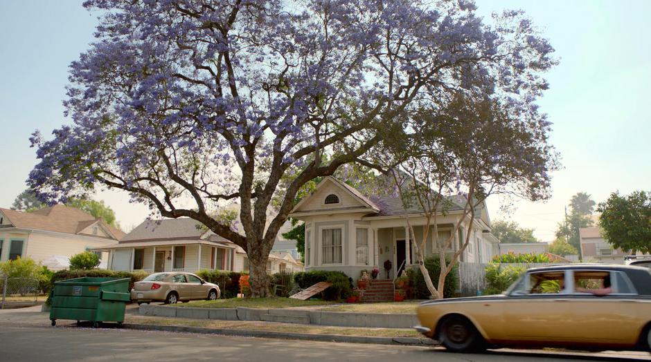 The Runaways pull up in front of the house where the stolen car is parked and see the front door lying in the yard after being ripped off its hinges.