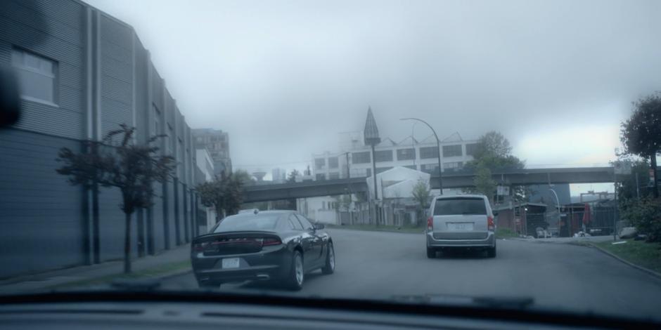 Jeff drives his car ahead of the group to get in front of Carly's vehicle.