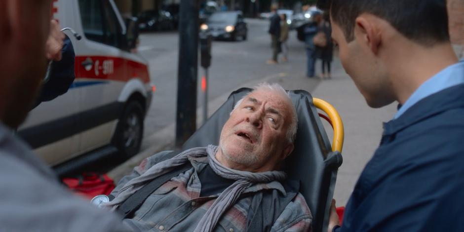 James Edward Bailey talks to the paramedic while lying on the gurney.