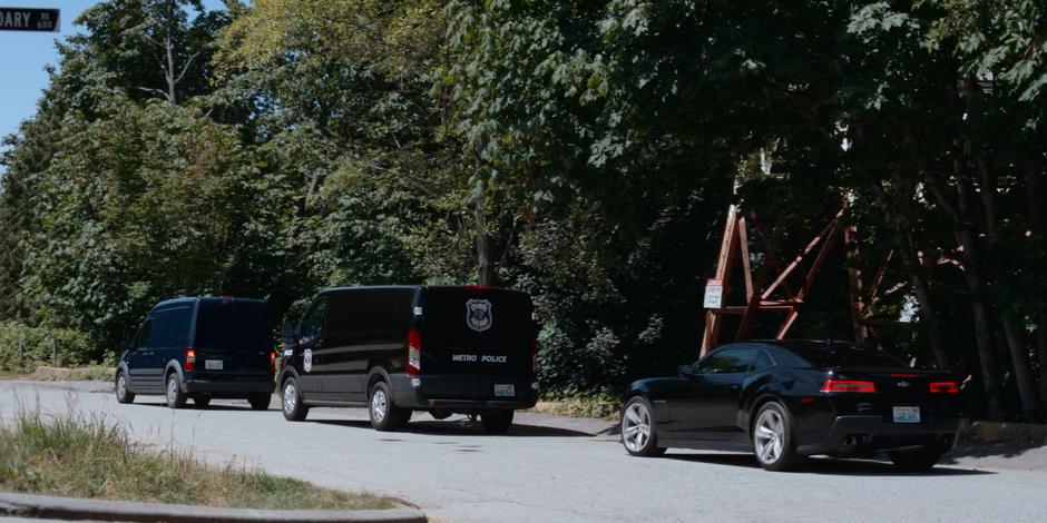 The police van stalls to a stop with Marcy's vehicle in front of it and Carly's behind.