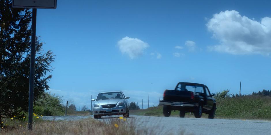 Andrew Graham and an oncoming car swerve around one another after he drifts into their lane.