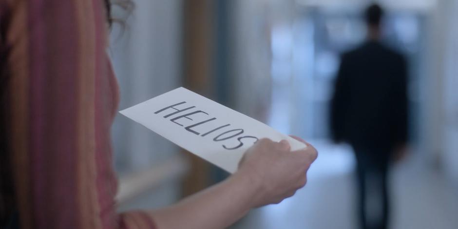 Samantha Burns holds up the envelope that has Helios written on it.